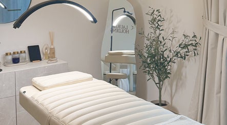 Tranquil treatment room at Lauren Brows and Beauty, Dubai, Dubai, AE, featuring a plush bed and elegant decor.