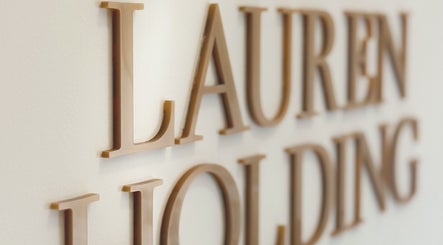 Close-up of elegant signage at Lauren Brows and Beauty, Dubai, Dubai, AE, featuring stylish lettering.