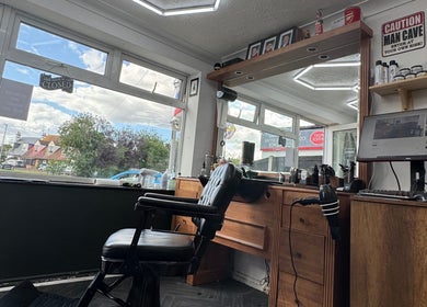Inside Gents & Co. Barbershop, Clacton-on-Sea, England, showcasing a sleek barber chair and modern decor.