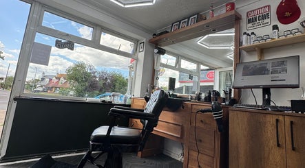 Inside Gents & Co. Barbershop, Clacton-on-Sea, England, showcasing a sleek barber chair and modern decor.