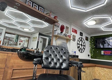 Interior of Gents & Co. Barbershop in Clacton-on-sea, England, featuring a stylish black barber chair.