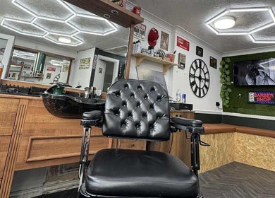 Stylish interior of Gents & Co. Barbershop in Clacton-on-sea, England, with leather chair and modern design.