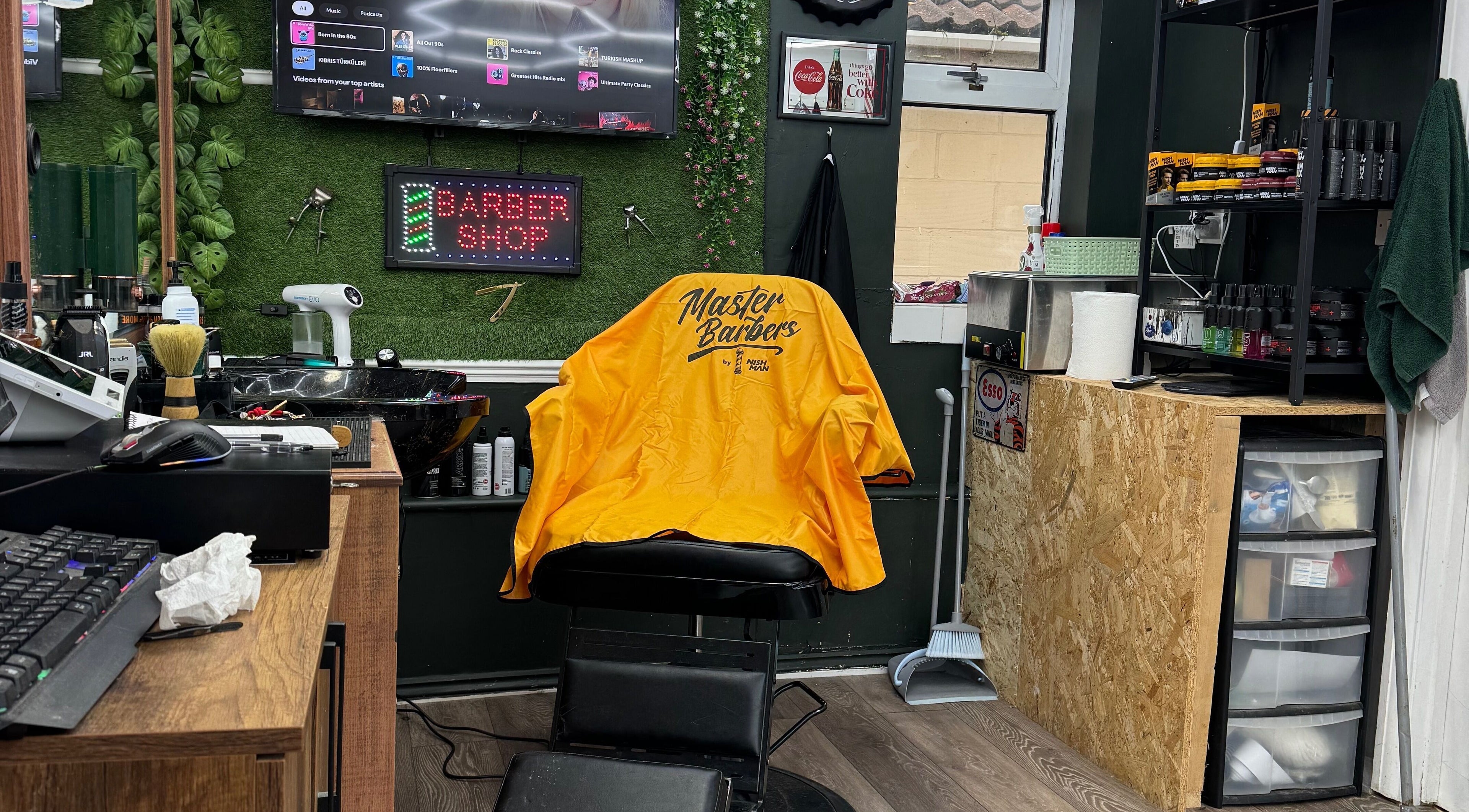 Stylish interior of Gents & Co. Barbershop in Clacton-on-sea, England, GB with modern barber chair.