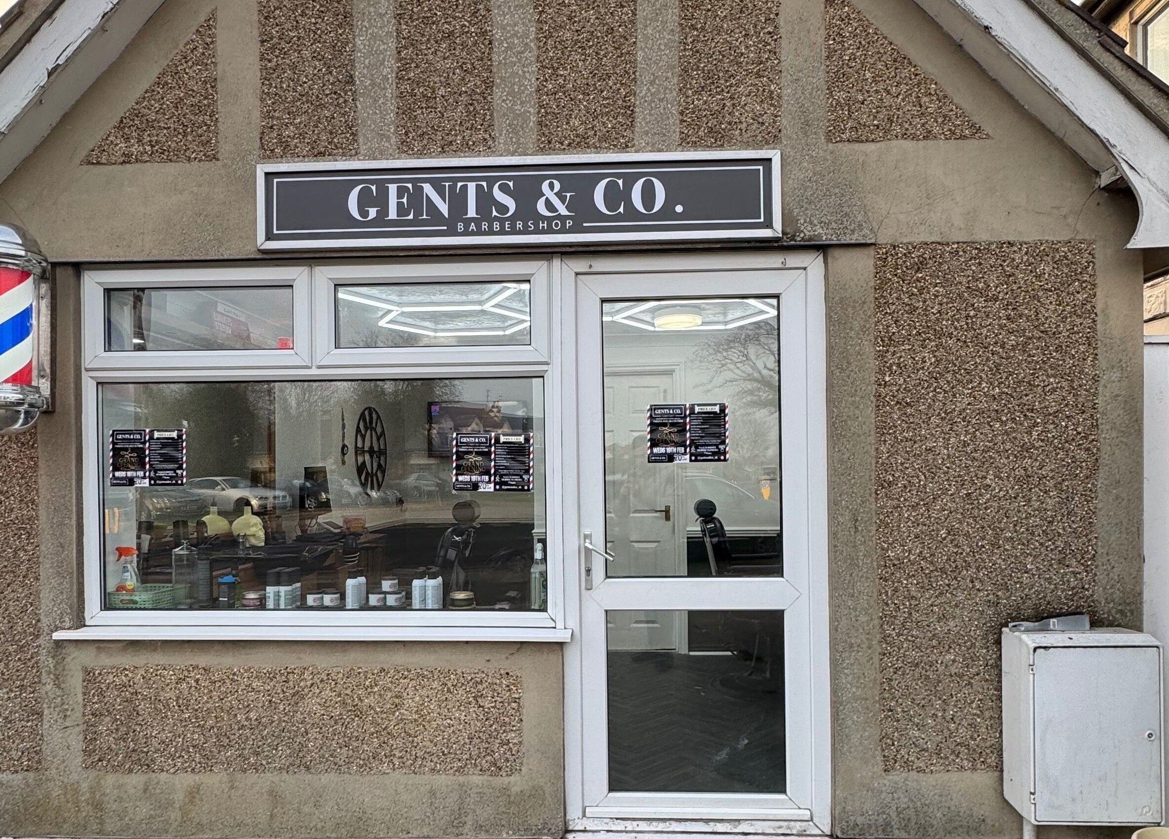 Front view of Gents & Co. Barbershop in Clacton-on-sea, England, GB with classic barber pole.
