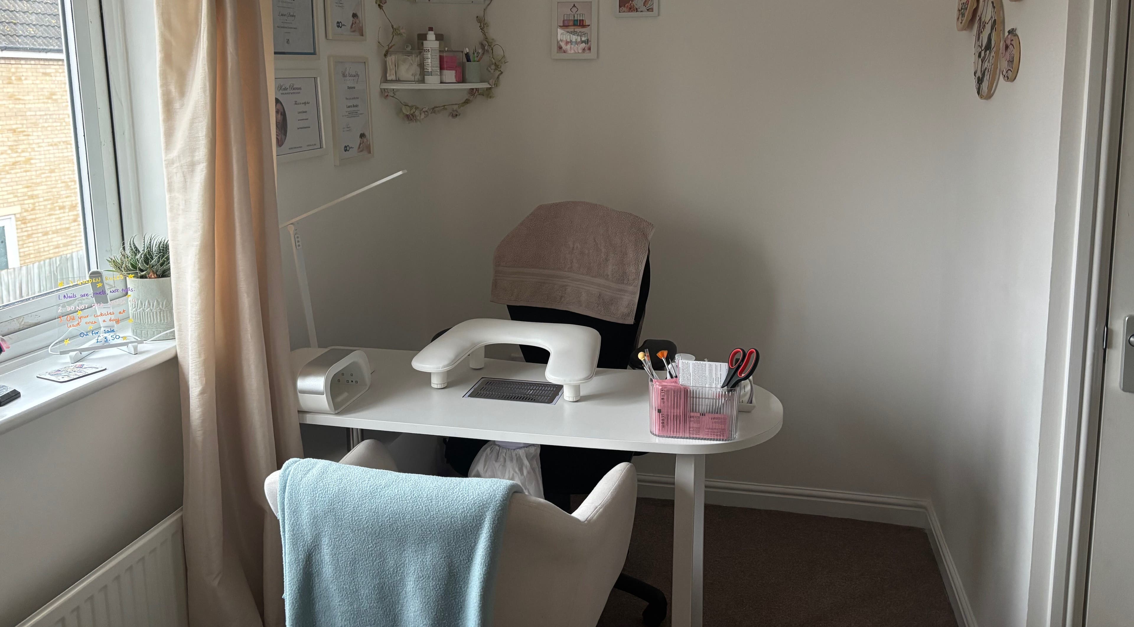 The Nail Room in Witchford, England, GB, featuring a cozy manicure station with soft lighting and tools.