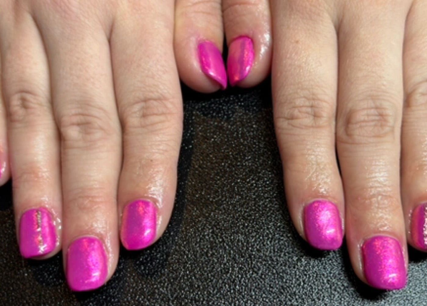 Bright pink manicure at The Nail Room, Witchford, England, GB, showcasing expert nail artistry.