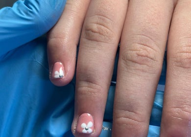 Close-up of floral nail art at Beauty By Eliza Grace, Broseley, England, GB. Delicate and stylish manicure.