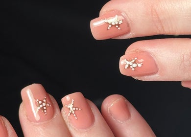 Elegant nude nail design with star accents at Beauty By Eliza Grace, Broseley, England, GB.
