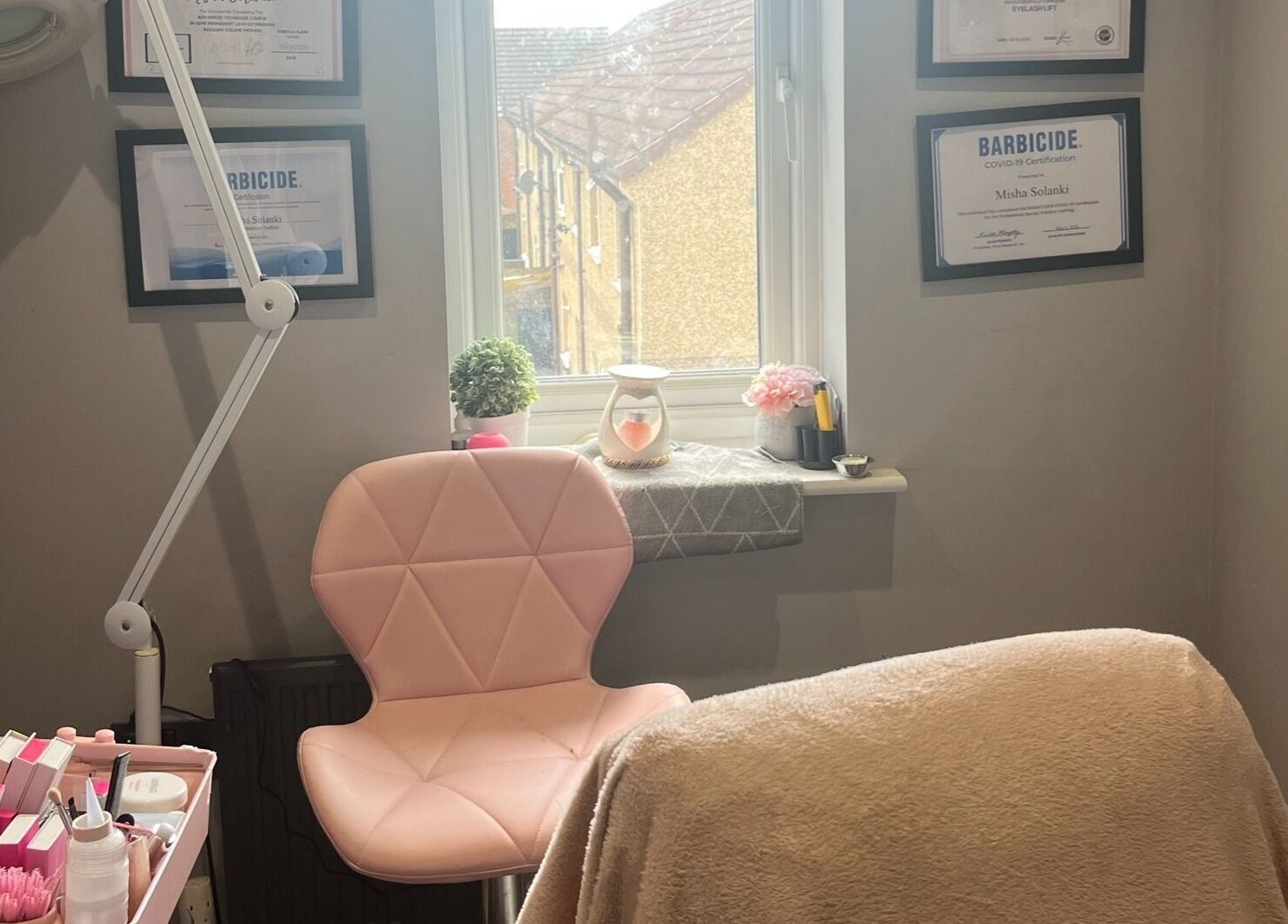 Eyelife - Lashes Oldham's tranquil treatment room in Oldham, England, GB with pink chair and decor.