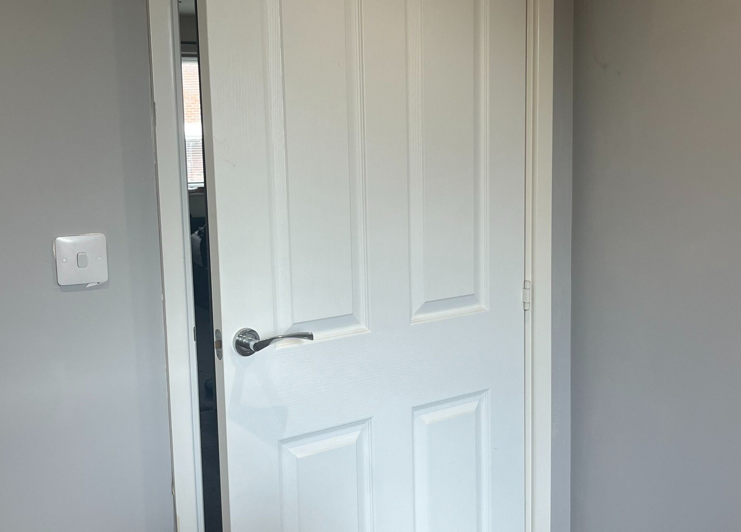 White door at Eyelife - Lashes Oldham, a serene space in Oldham, England, GB.