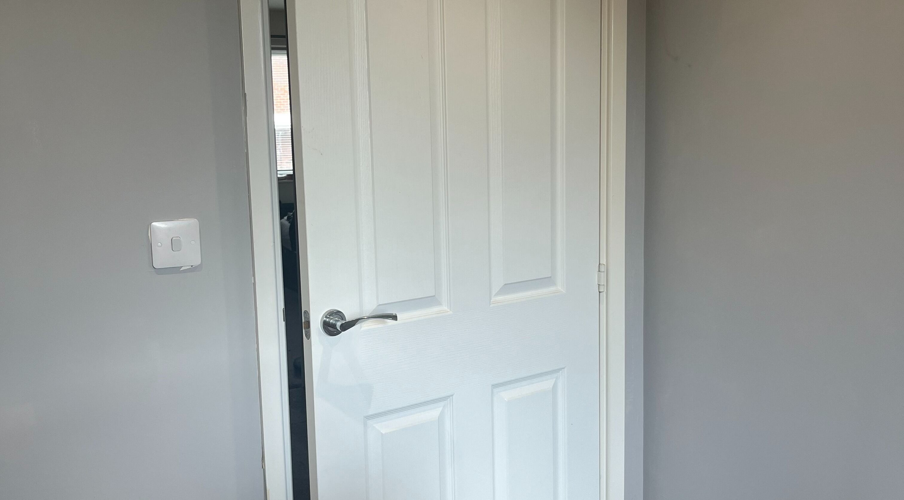 White door at Eyelife - Lashes Oldham, a serene space in Oldham, England, GB.