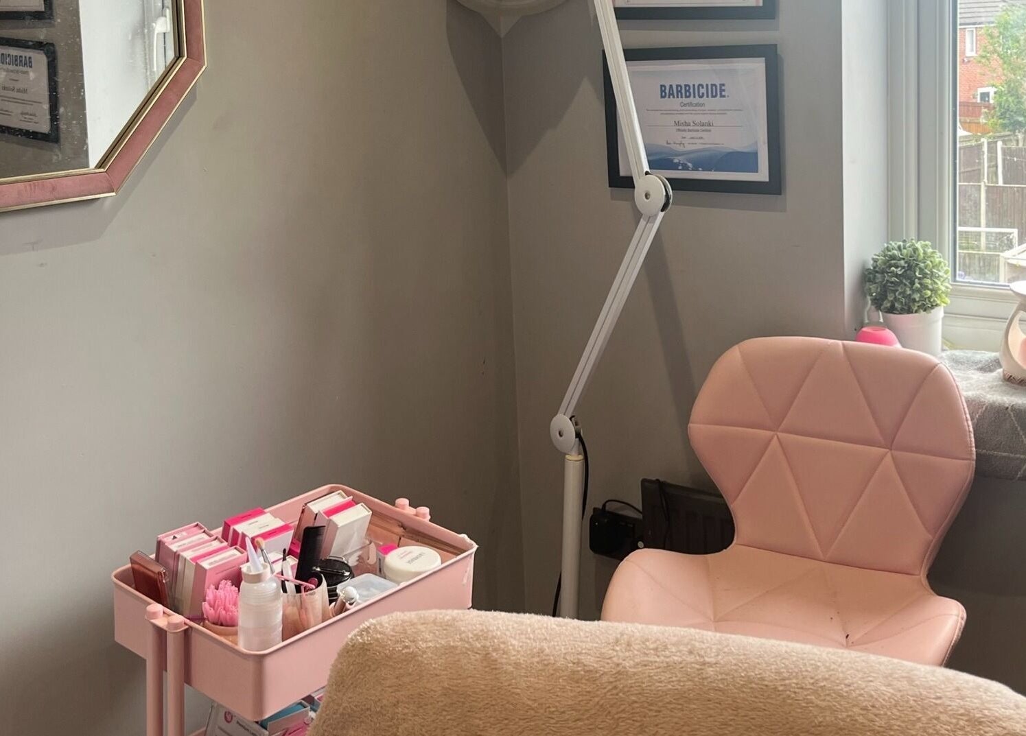 Cozy beauty setup at Eyelife - Lashes Oldham, Oldham, England, GB with pink chair and beauty tools.