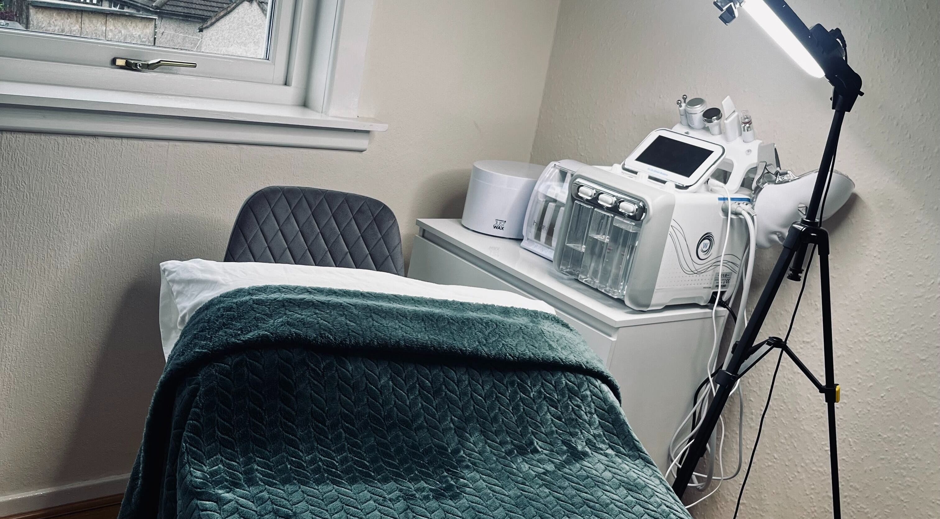 Relaxing treatment room at Kirsty Allen Beauty, Prestonpans, Scotland, GB with modern equipment and cozy ambiance.