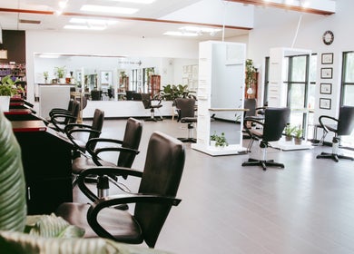 Interior of Venue Salon in Lakeland, Florida, US featuring chic styling stations and plush chairs.