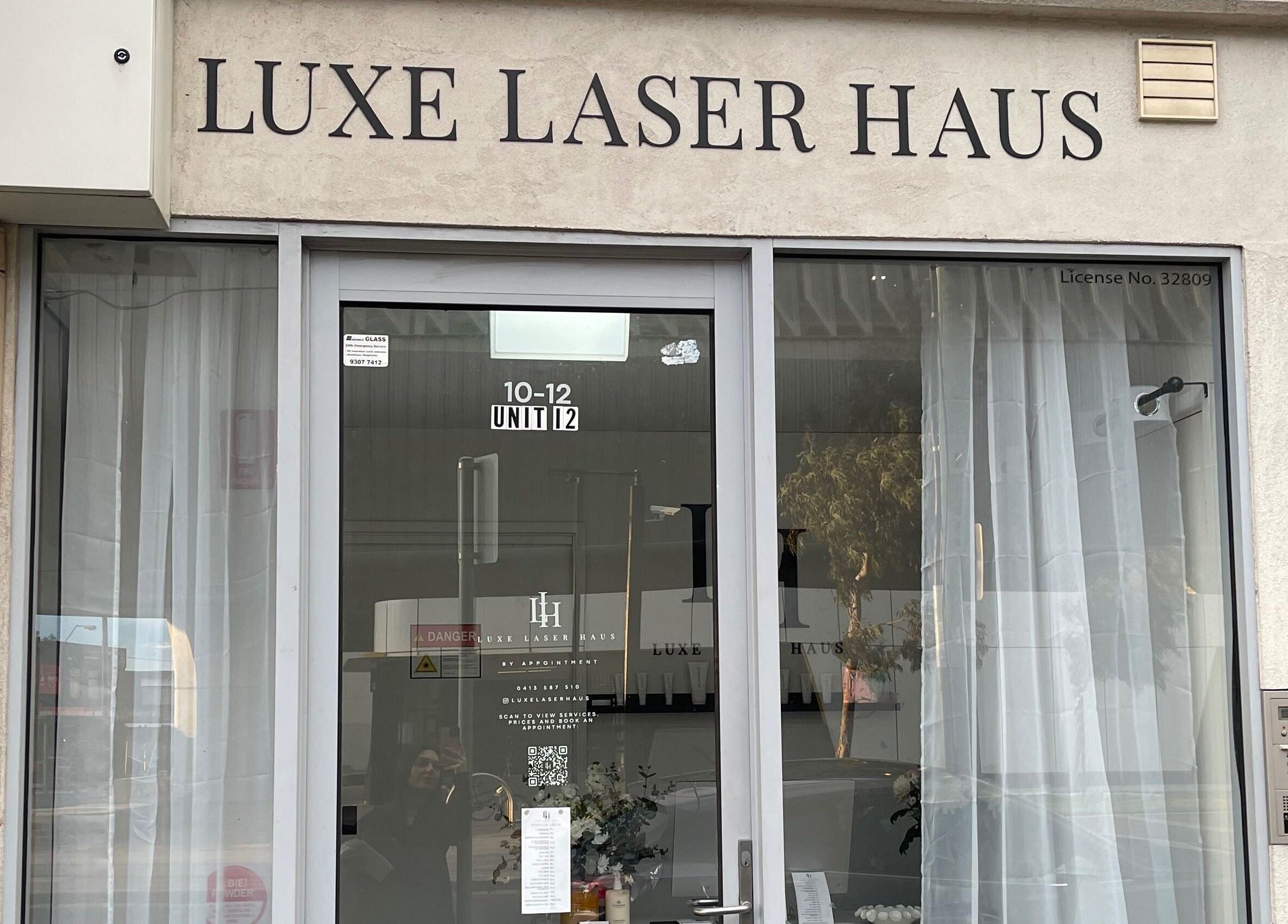 Entrance of Luxe Laser Haus in Carnegie, Victoria, AU. Elegant glass doors welcome visitors.
