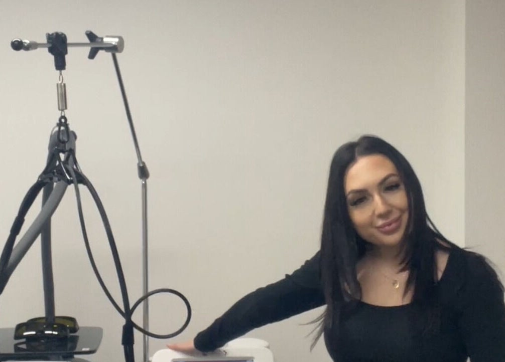 Professional at Luxe Laser Haus with laser equipment in Carnegie, Victoria, AU.