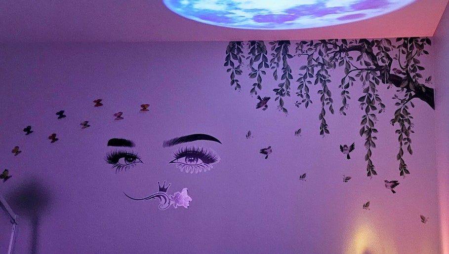 Artistic wall mural at Glowing Beauty in Christchurch, Canterbury, NZ, featuring eyes and nature elements.