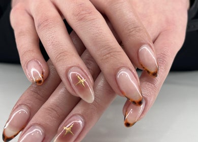 Beautifully styled nails at NuNails Cape Town, Cape Town, Western Cape, ZA with artistic designs and glossy finish.