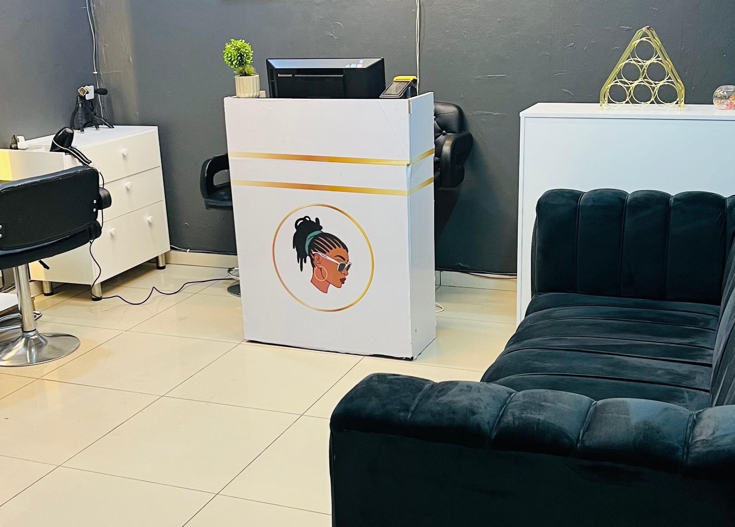 Stylish salon interior at Loctician Carlocs Studio - Johannesburg, highlighting modern seating and decor. Johannesburg, Gauteng, ZA.