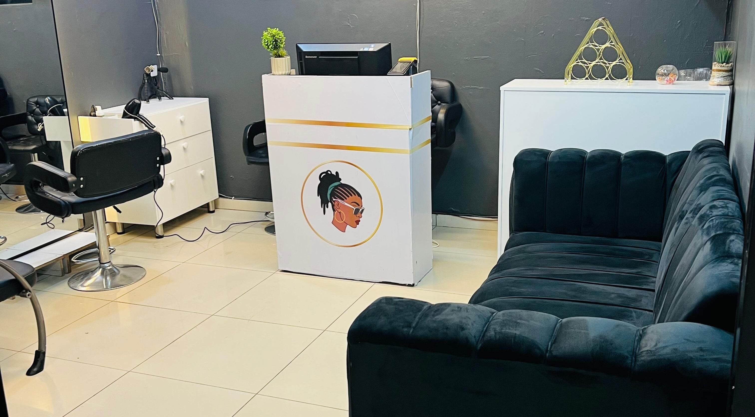 Stylish salon interior at Loctician Carlocs Studio - Johannesburg, highlighting modern seating and decor. Johannesburg, Gauteng, ZA.