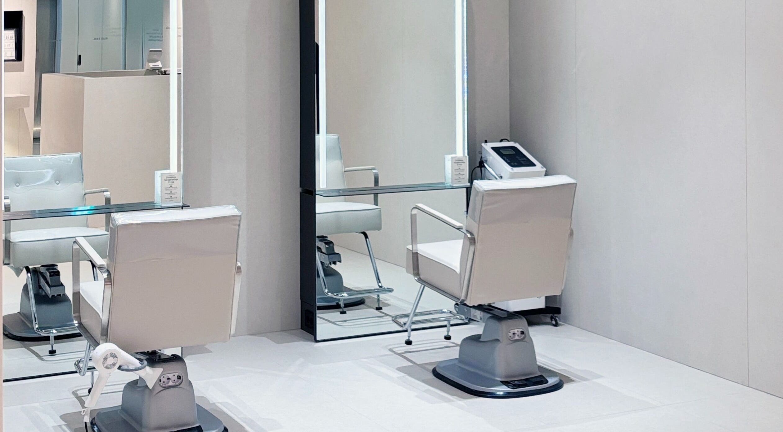 Modern salon chair at Juno Hair Myeongdong Art Theater Branch in Seoul, South Korea.