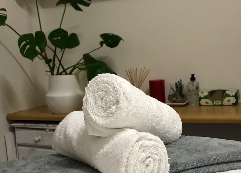 Luxurious spa towels on a treatment bed at Jessie Beauty, Cape Town, Western Cape, ZA.