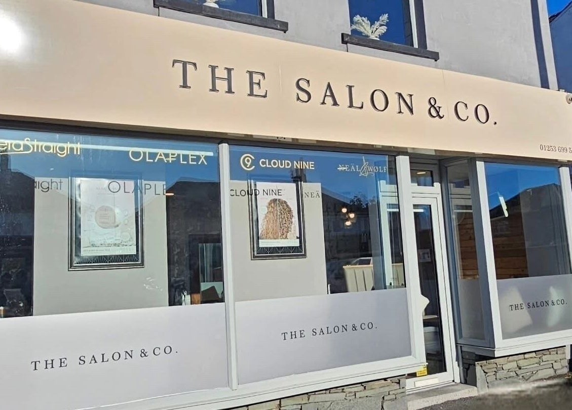 Front entrance of Created By Con salon in Blackpool, England, GB showcasing stylish signage.