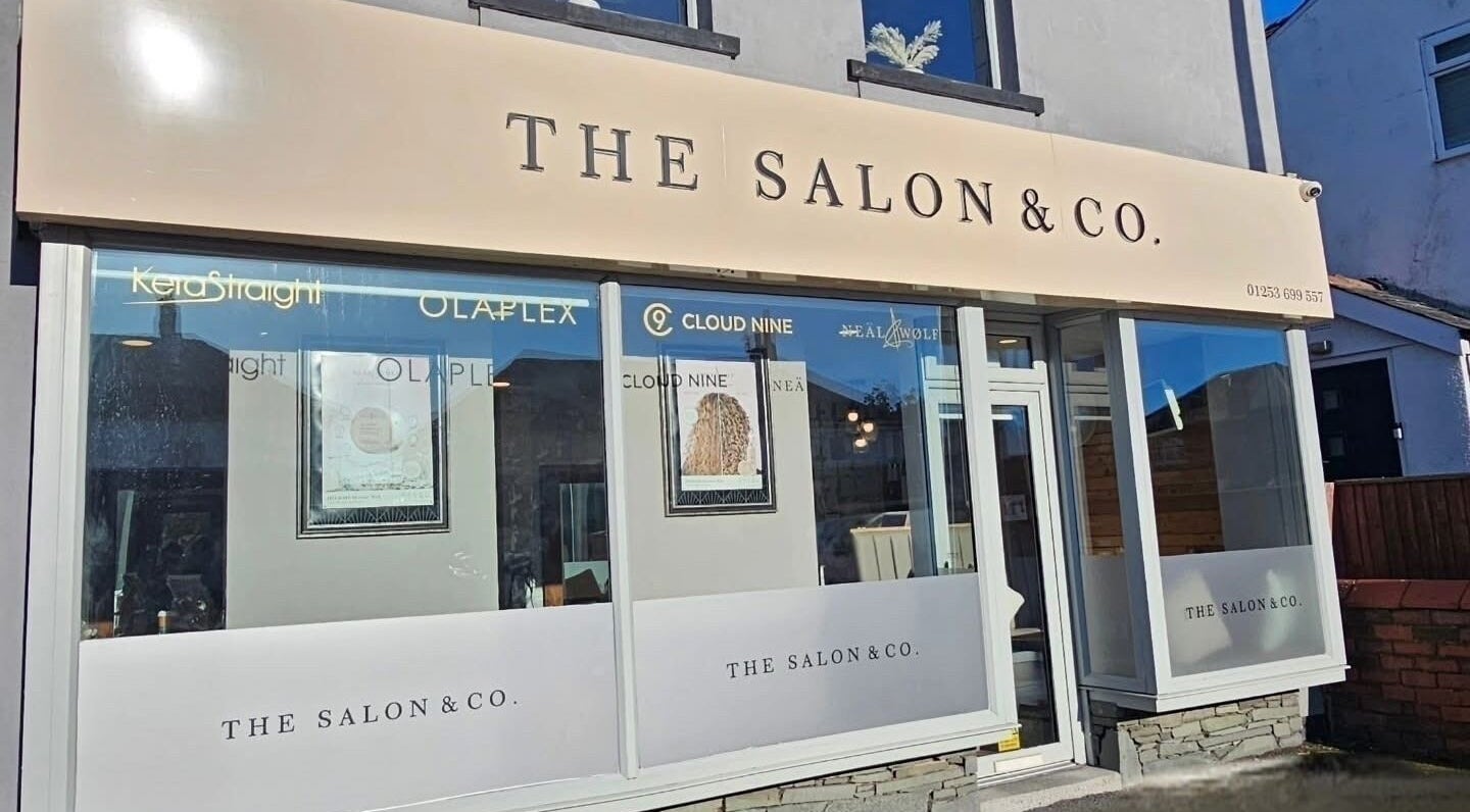 Front entrance of Created By Con salon in Blackpool, England, GB showcasing stylish signage.