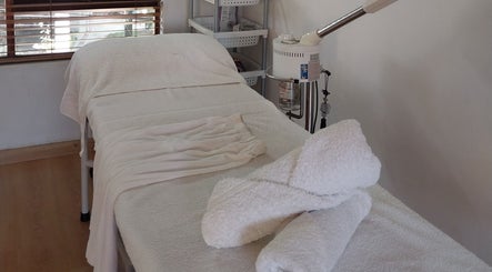 Spa treatment room at TWO'S COMPANY Hair & Beauty in Sandton, Gauteng, ZA for peaceful relaxation.