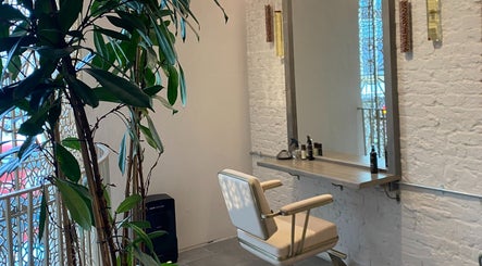 Elegant styling chair and mirror at VITA Glow Hair Salon & Head Spa, London, England, GB.