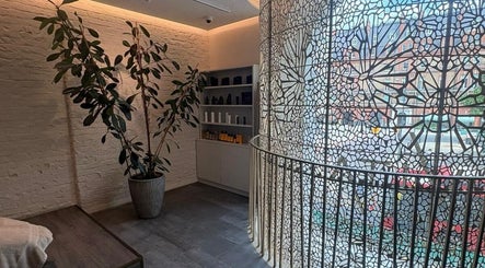 Elegant interior of VITA Glow Hair Salon & Head Spa in London, England, GB, featuring a stylish design.