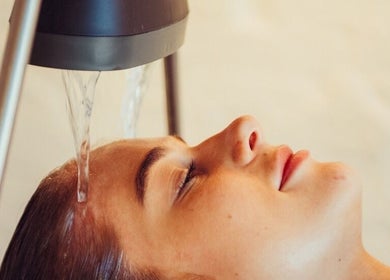 Client enjoying head spa treatment at VITA Glow Hair Salon & Head Spa, London, England, GB.