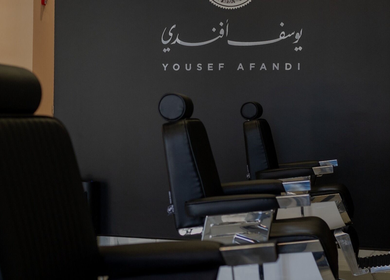 Stylish barber chairs in sleek setting at Yousef Afandi-Shiekh Zayed, Giza Governorate, Giza Governorate, EG.