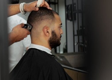 A customer receives a precise haircut at Yousef Afandi Express- Madina Nasr, Giza Governorate, Giza Governorate, EG.