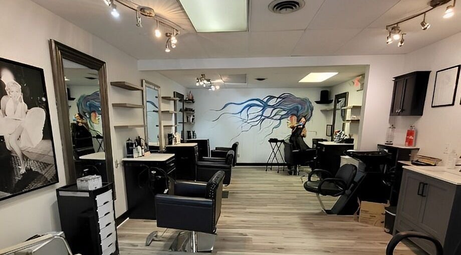 Stylish interior of Hairspray Salon in Westborough, Massachusetts, US featuring modern seating and decor.