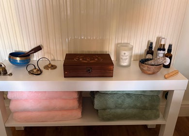 Holistic healing items on a shelf at Beauty Within, Hull, England, GB, creating a calming atmosphere.