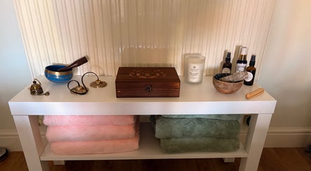 Holistic healing items on a shelf at Beauty Within, Hull, England, GB, creating a calming atmosphere.