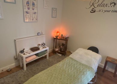 Relaxing treatment room at Beauty Within, Hull, England, GB with massage bed and calming decor.