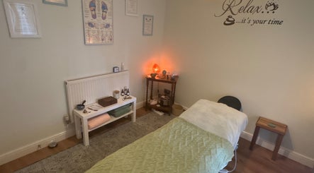 Relaxing treatment room at Beauty Within, Hull, England, GB with massage bed and calming decor.
