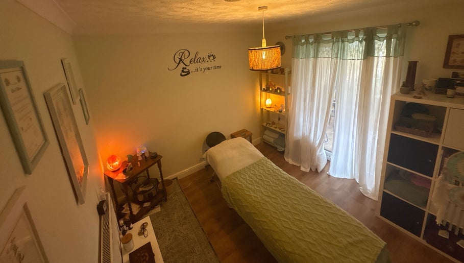Relaxing massage room at Beauty Within, Hull, England, GB, with ambient lighting and cozy decor.