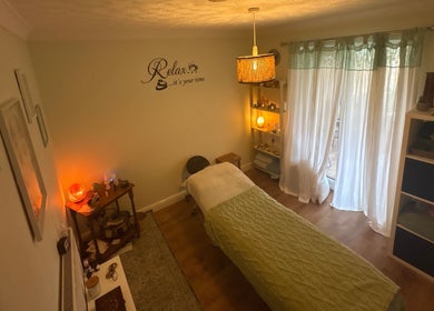 Relaxing massage room at Beauty Within, Hull, England, GB, with ambient lighting and cozy decor.