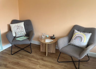 Comfortable seating area at Beauty Within, Hull, England, GB featuring plush chairs and a warm ambiance.