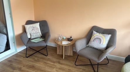 Comfortable seating area at Beauty Within, Hull, England, GB featuring plush chairs and a warm ambiance.