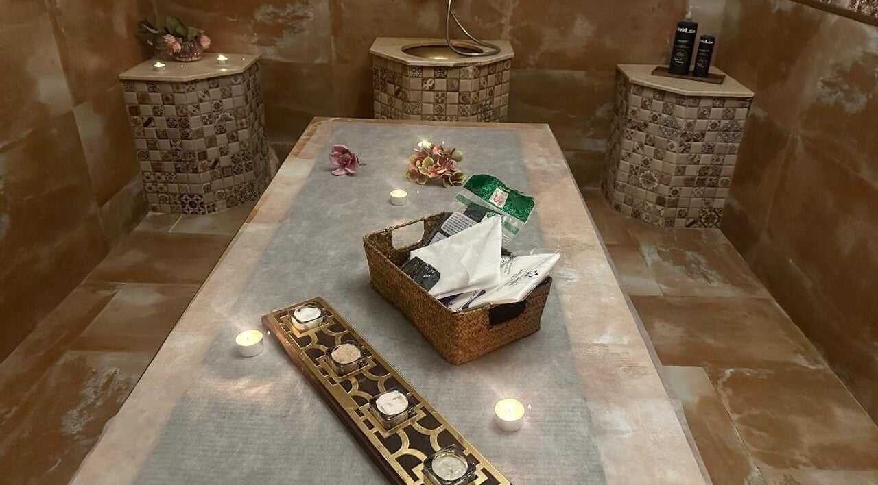 Luxurious hammam at Can Beauty Salon | Hayel, Hayel, SA, featuring candles and ornate decor for a relaxing experience.
