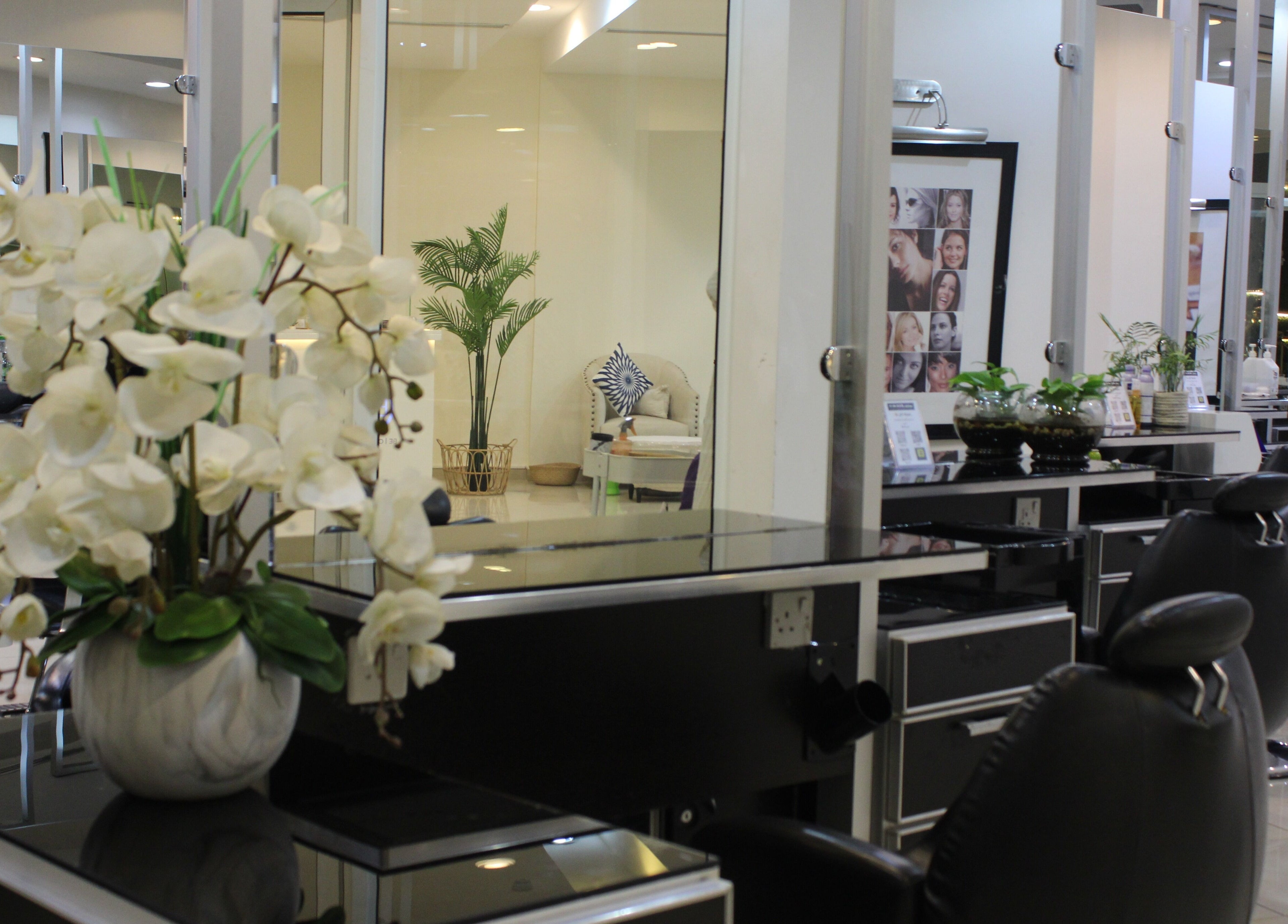 Spacious interior of Can Beauty Salon | Hayel in Hayel, SA, showcasing modern styling stations with sleek decor.