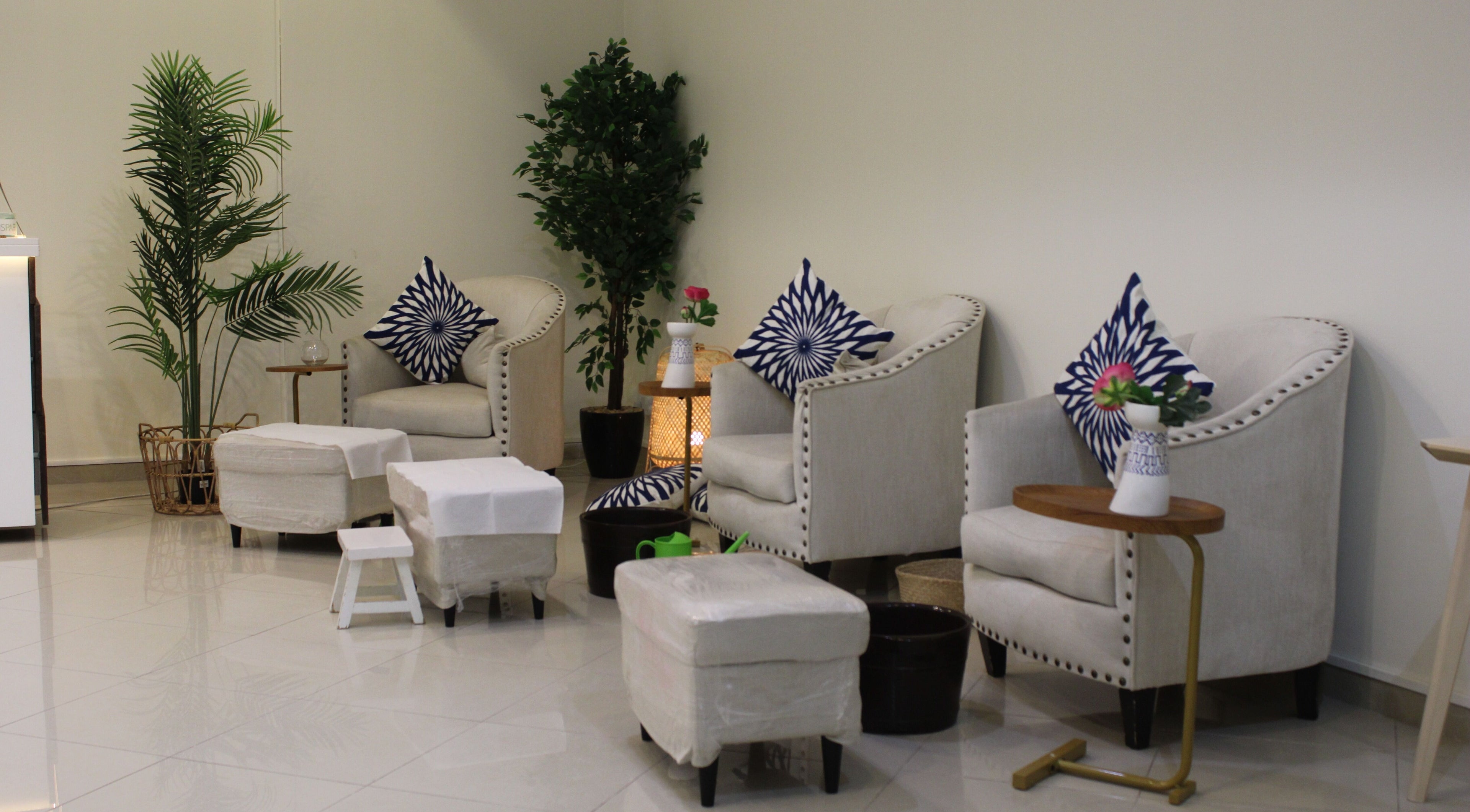 Elegant seating area at Can Beauty Salon | Ar Rass, featuring plush chairs and greenery. Al Rass, Al Rass, SA.