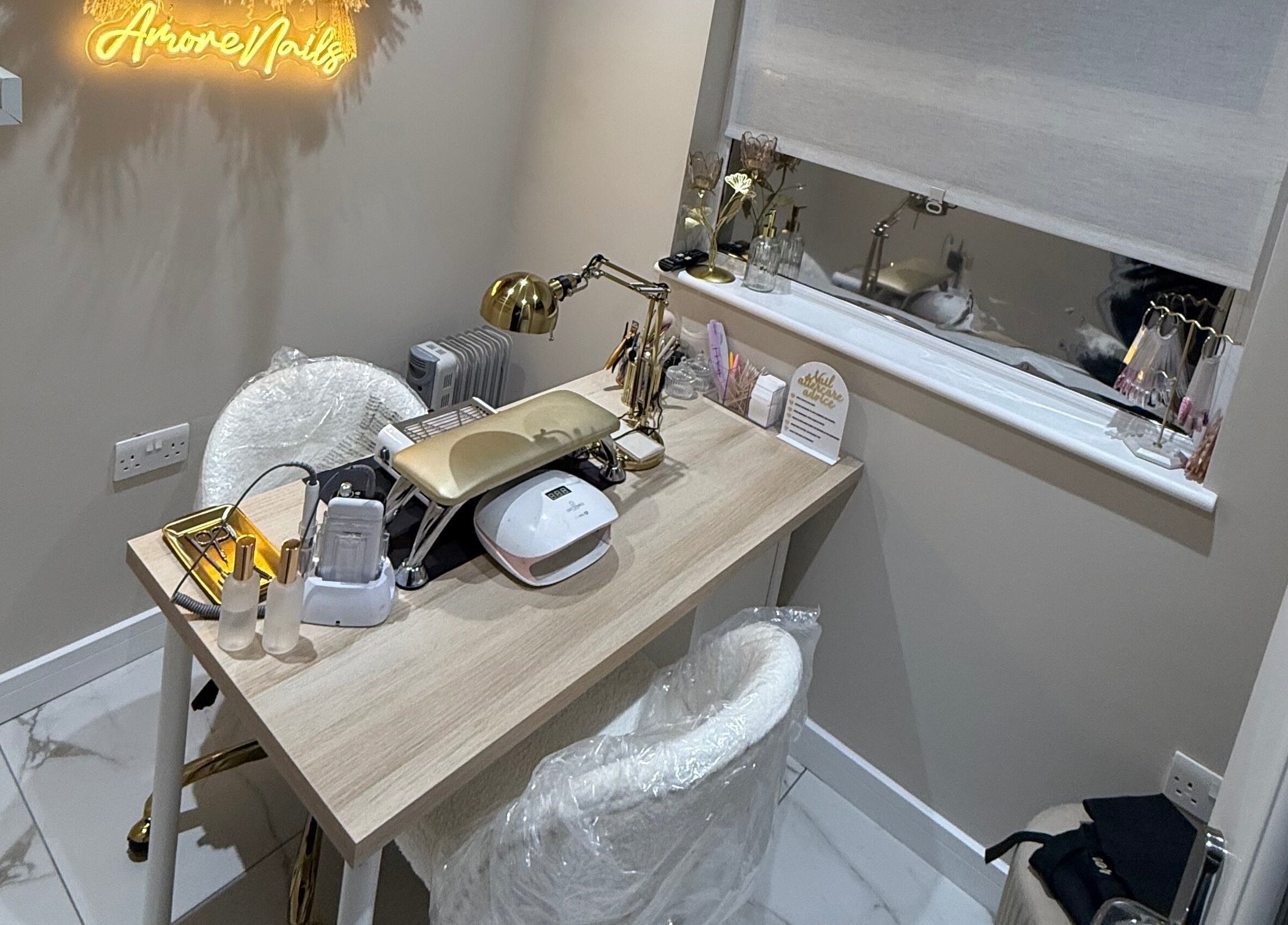 A chic nail station at Amore Nails & Beauty By Jayne in Birtley, England, GB, showcasing elegant decor.
