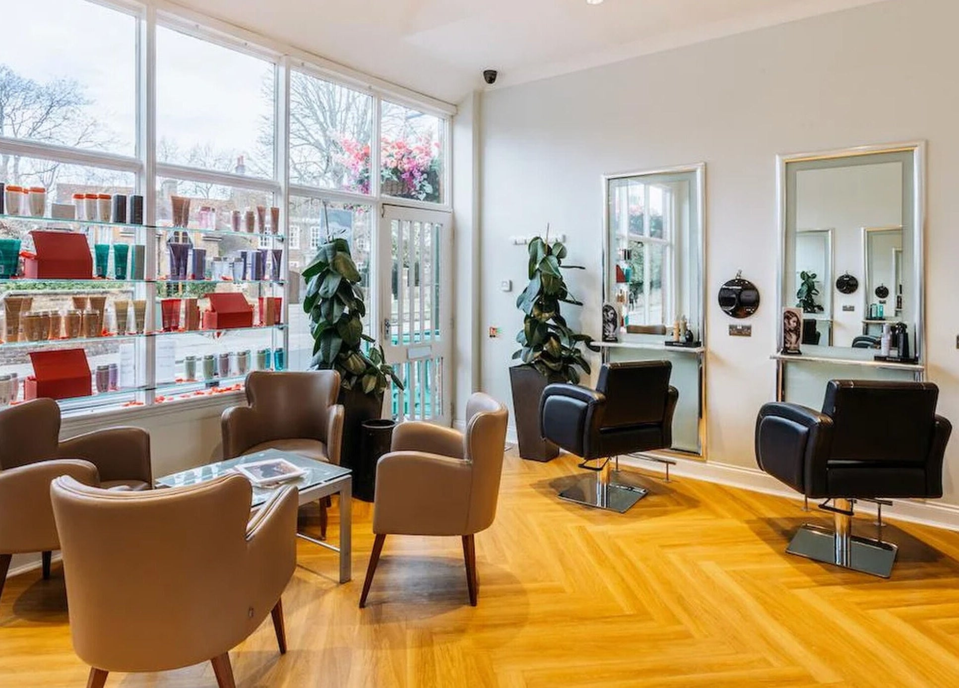 Stylish interior of Making Waves Salon in London, England, GB with modern chairs and bright natural lighting.