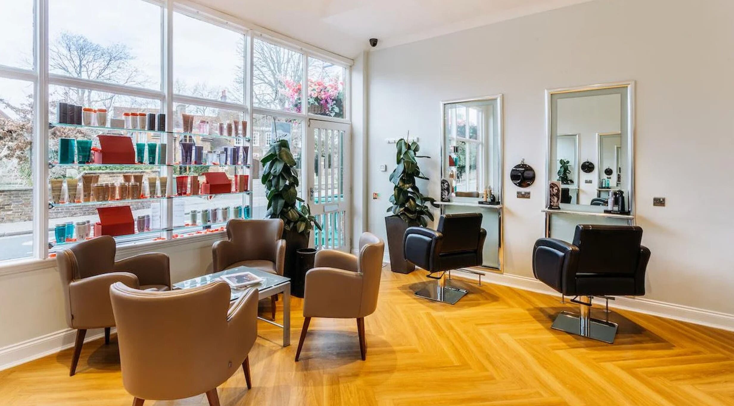 Stylish interior of Making Waves Salon in London, England, GB with modern chairs and bright natural lighting.