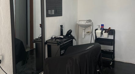 Modern salon interior at StudioGunteng, Cheras, Wilayah Persekutuan Kuala Lumpur, MY featuring elegant styling tools.